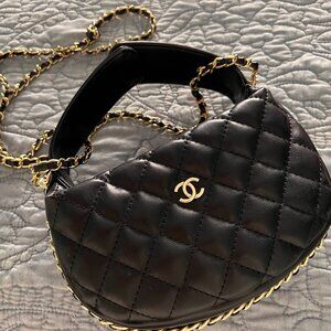Black petit tuffed mini bag with gold braid trim;